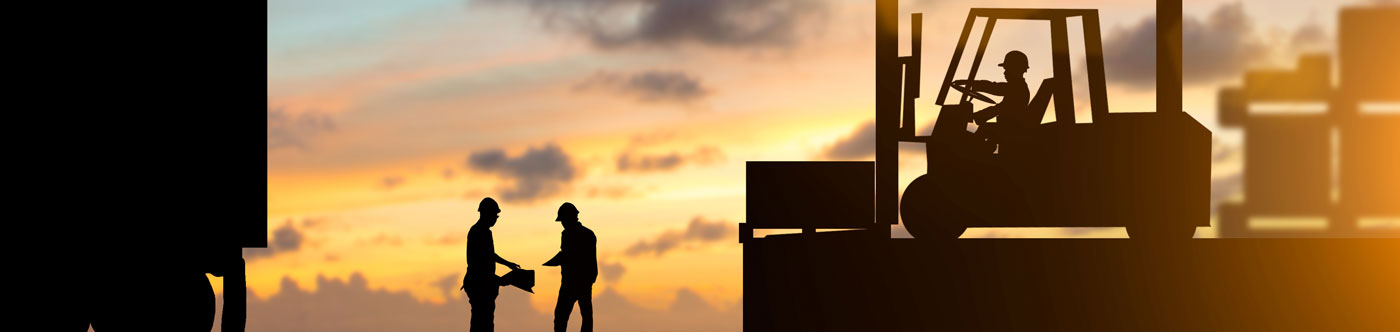 logistics workers silhouetted at sunset