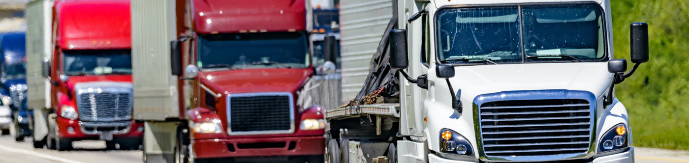 semi trucks driving on a highway