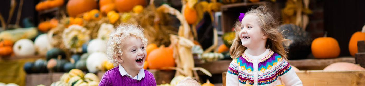 laughing children at a pumpkin festival